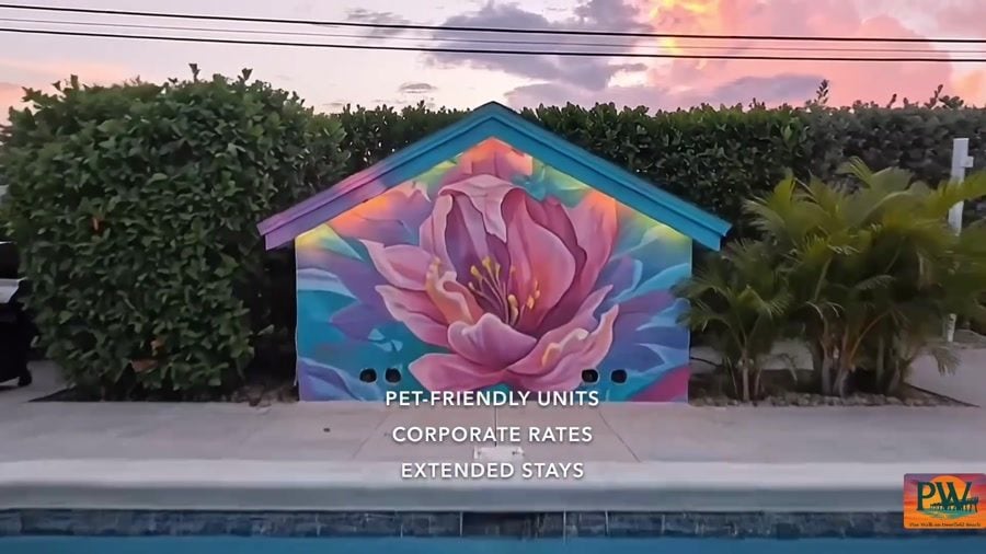 Pool and mural shot from the commercial: Pet-Friendly Units, Corporate Rates, Extended Stays